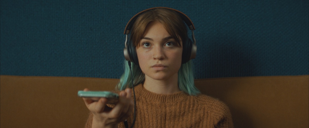 Sylvie Mix is insanely watchable as Lennon, the film's podcaster protagonist (image provided by Oscilloscope)